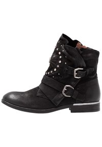 Black leather ankle boot with a rounded toe, buckled straps, and studded accents. Features textured material and a low, square heel.