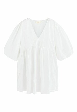White blouse with V-neck, puffed short sleeves, and gathered waist detailing, made of lightweight textured fabric.
