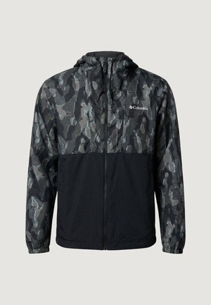 Veste zippée à capuche avec camouflage noir et gris, poignets élastiques, ornée d'un logo Columbia blanc sur la poitrine.