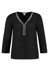 Schwarze Bluse mit Dreiviertelärmeln, V-Ausschnitt und einem dekorativen silbernen Perlenbesatz entlang des Ausschnitts. Glatte Stoffstruktur.