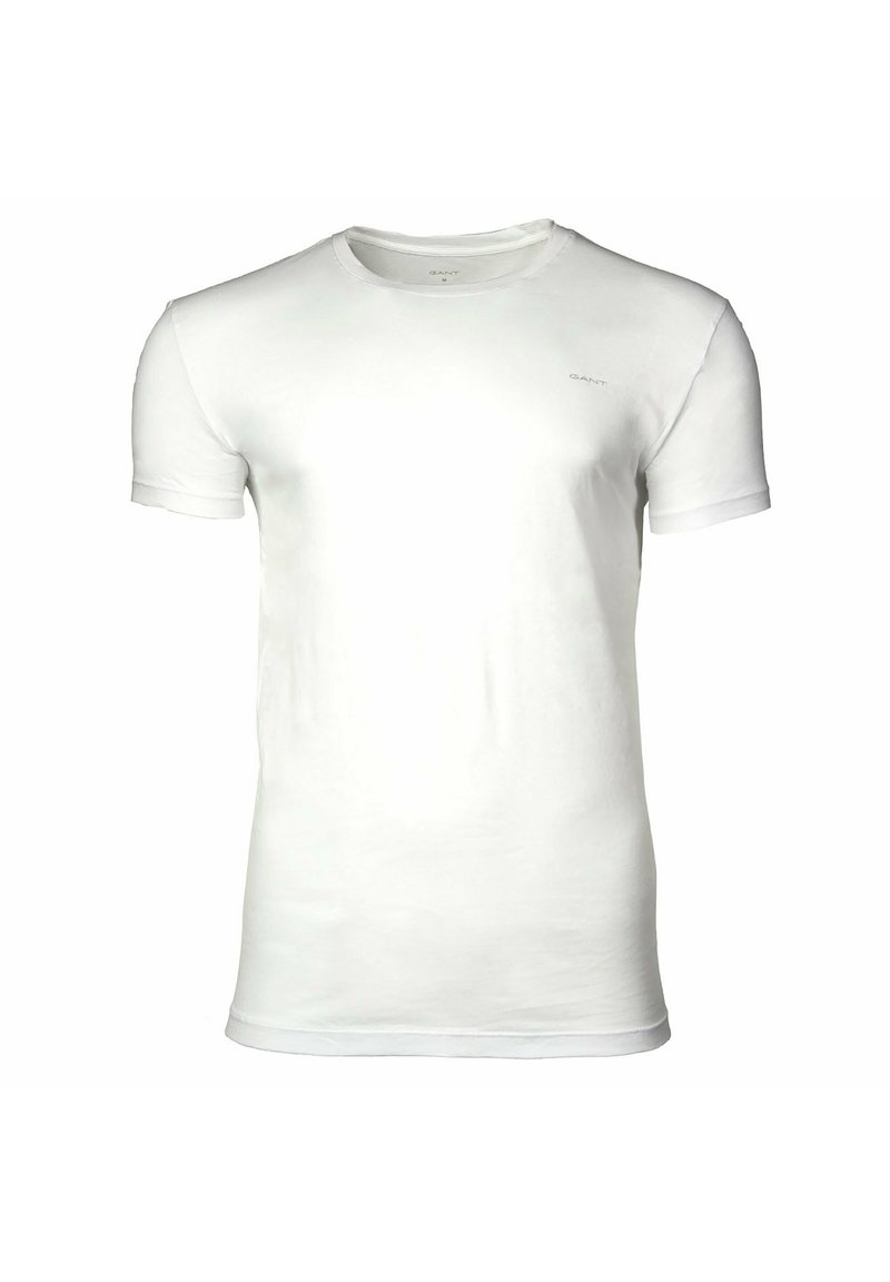 T-shirt bianca a maniche corte con scollo rotondo e piccolo logo "GANT" sul petto sinistro, mostrata su uno sfondo bianco semplice.