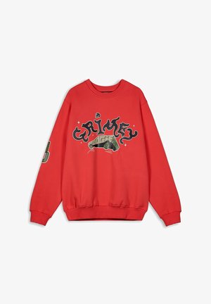 Red sweatshirt featuring "Grimey" graphic in black, with a vehicle illustration and accents on the sleeves. Soft cotton material, relaxed fit.