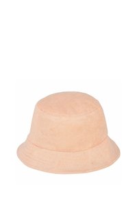 Perzikenkleurige bucket hat gemaakt van zachte, gestructureerde stof met een ronde kroon en een brede, naar beneden hellende rand.