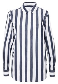 Randig skjorta i marinblått och vitt, tillverkad av lättviktig tyg. Har långa ärmar, krage och en bröstficka.