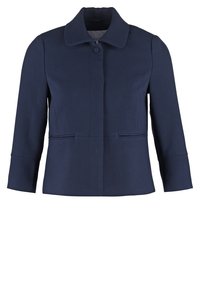 Blazer pour femmes bleu marine à manches longues, avec un seul bouton recouvert au col et deux poches avant passepoilées.