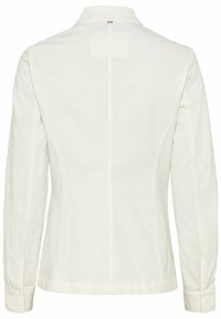 Biała kurtka z długim rękawem i kołnierzem, o prostym kroju z detalami szwów na plecach. Miękki materiał o gładkiej fakturze.