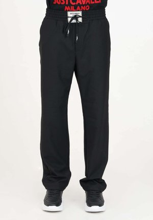 CON PATCH IN LOGATA - Pantaloni - black