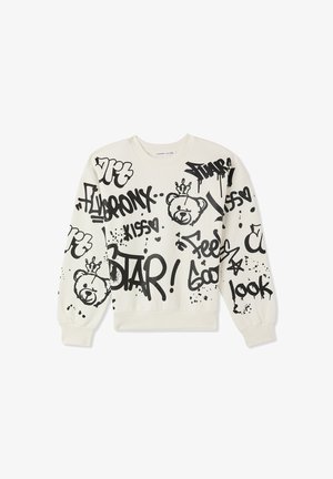 Kremowa bluza z czarnym tekstem w stylu graffiti oraz ilustracją niedźwiedzia. Z ribbowanymi mankietami i dołem, o luźnym kroju i miękkiej fakturze.
