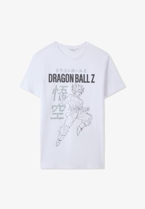 T-shirt bianco in cotone con una grafica a contorno nera di un personaggio di Dragon Ball Z con testo giapponese. Maniche corte e vestibilità comoda.