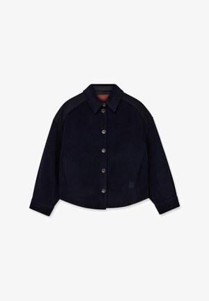Navy blue overshirt made of soft fabric, featuring a buttoned front, collar, and contrasting black shoulder accents.
