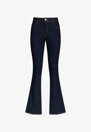 Tumši zili augsta vidukļa džinsa džinsi ar izplestām kājsaitēm, priekšējo pogu aizdari un kontrastainu šuvju apdari uz kabatām un šuvēm.