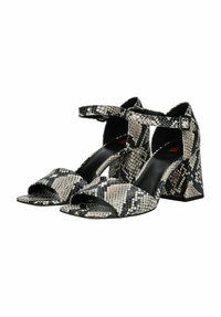 Sandali con tacco a blocco in pelle a fantasia serpente bianco e nero, con cinturino alla caviglia, punta aperta e tacco spesso. Interno in pelle liscia.
