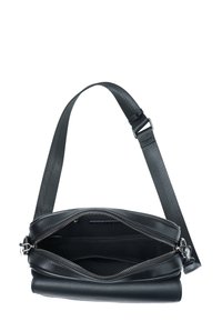 Black leather handbag with a zip closure, textured body, and adjustable strap. Interior features compartments for organization.