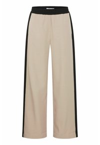 Pantalons larges beige avec une bande latérale noire, taille élastique, texture lisse et design simple. Convient pour un usage décontracté.