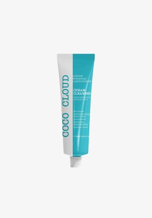 Coco Cloud cream cleanser in a squeezable tube features a white and aqua blue design, with white lettering on each side and a twist-off cap.