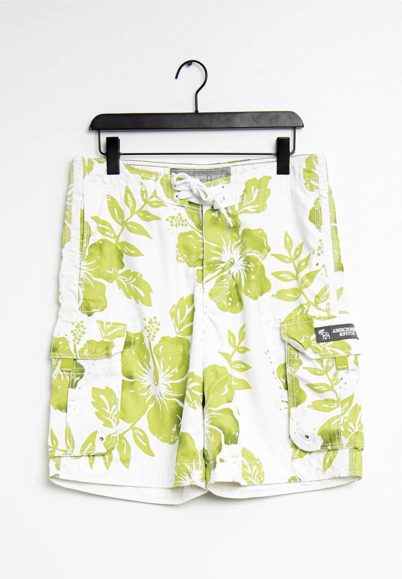Shorts de bain blancs avec un grand motif floral vert, taille élastique avec cordon de serrage, poches latérales et patch logo sur la poche droite.