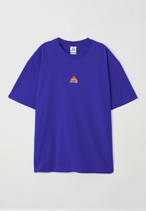 Purple cotton t-shirt with short sleeves, featuring a small orange ACG logo on the chest. Crew neck design and relaxed fit.