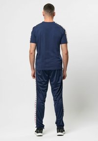 Kappa BANDA ASTORIA - Trainingsbroek - blue iris brown lt honey