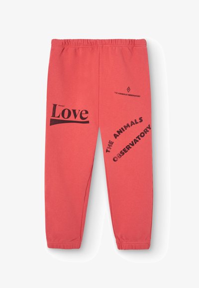 Korallefarbene Jogginghosen mit elastischem Bund; mit schwarzem Text "Always Love" und "THE ANIMALS OBSERVATORY" in verschiedenen Schriftgrößen.