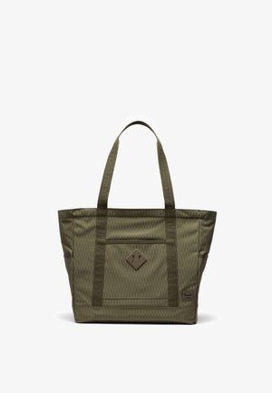 Sac cabas vert olive en tissu à motif losanges, doté de deux anses pour l'épaule, d'une poche frontale et d'un écusson carré avec logo dans le coin inférieur droit.
