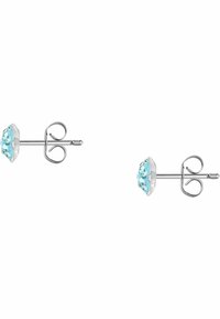 Orecchini a questo in argento sterling con un gruppo di cristalli azzurri in un montaggio rotondo, con una superficie liscia e lucida.
