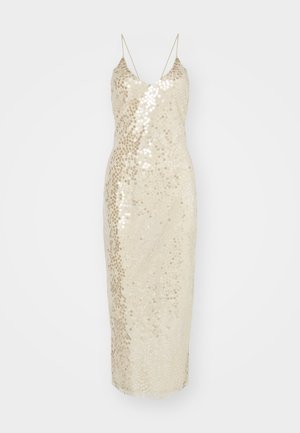 Μακρύ φορεμα με παγιέτες σε κρέμ απόχρωση, με στενή γραμμή, μίνι μήκος και λεπτές τιράντες. Το ύφασμα είναι διακοσμημένο με λαμπερές παγιέτες.