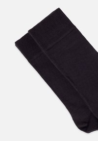 Svarta bomullssockor med ribbad mudd och slät textur, med en enkel, sömlös design för en klassisk look.