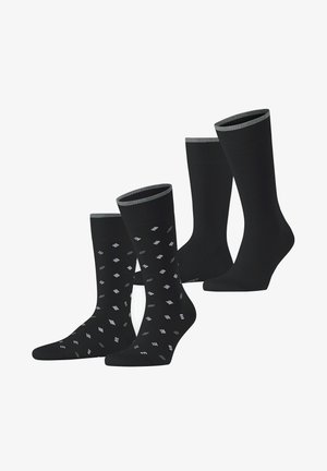 Schwarze Socken in zwei Stilen: eine einfarbig mit gerippten Bündchen, die andere mit einem geometrischen Muster in Grau und Weiß. Weiches, dehnbares Material.