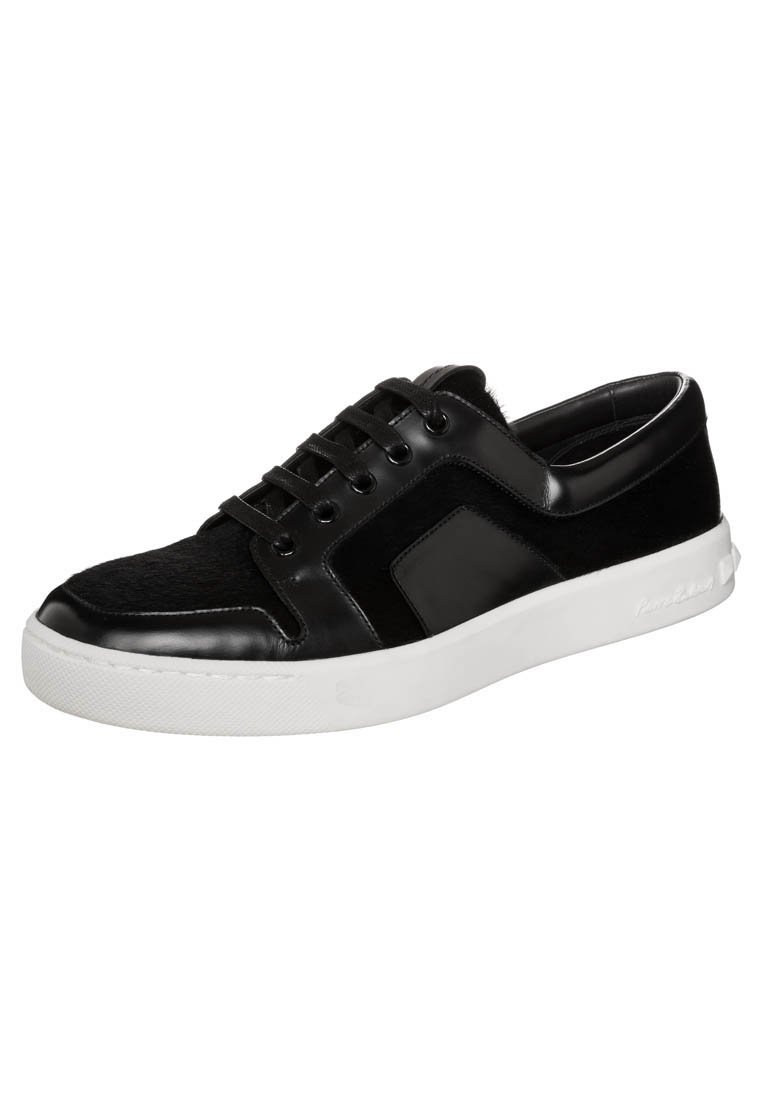 Black sneaker with a smooth leather and textured upper, featuring a white rubber sole, round laces, and a side logo detail.