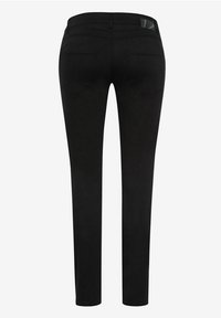 Vaqueros negros de diseño ajustado, con una cintura de altura media, dos bolsillos traseros y una textura suave. La tela parece duradera y flexible.