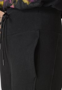 Deha JOGGER - Trainingsbroek - black