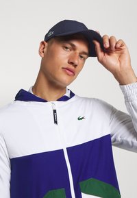 Lacoste Sport - TENNIS UNISEX - Naģene - navy blue Miniatūras attēls 1