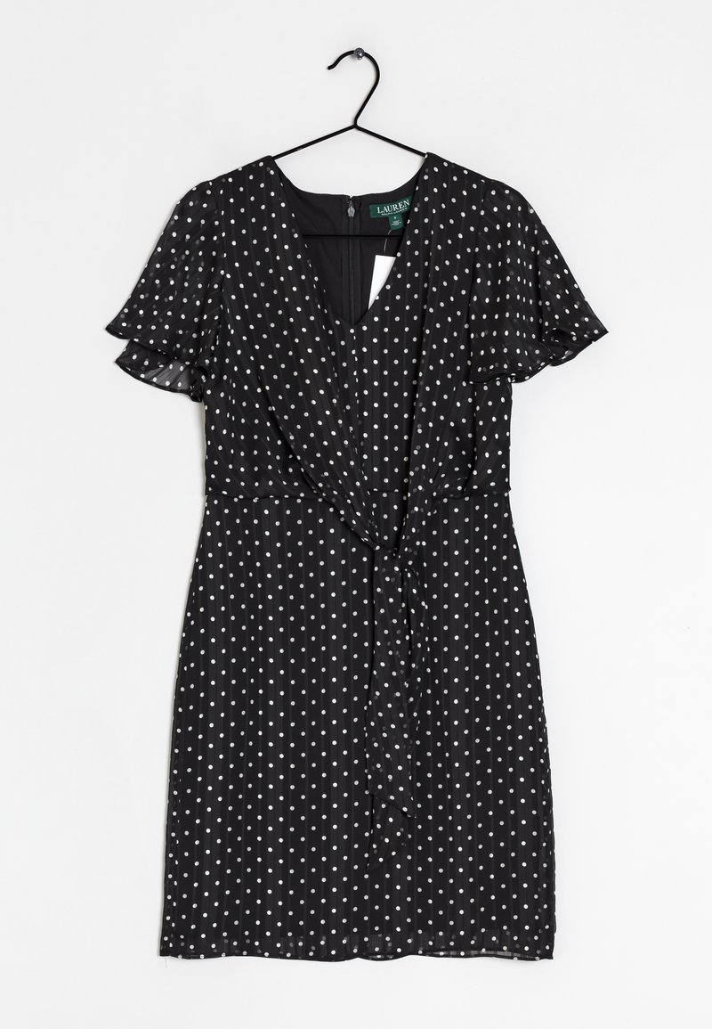 Black dress with white polka dots, V-neckline, short flutter sleeves, wrap design with a tie at the waist, lightweight textured fabric.