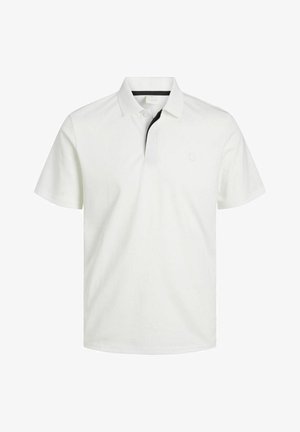 Polo blanc en coton, avec un col classique, des manches courtes et un logo discret sur la poitrine. Accent noir à l'intérieur du col.