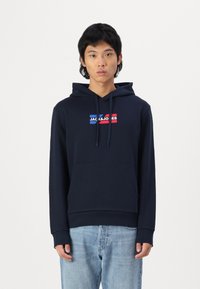 Navy blue hoodie with a front pocket and drawstring hood. Features a multicolored logo on the chest in red, blue, and white accents.