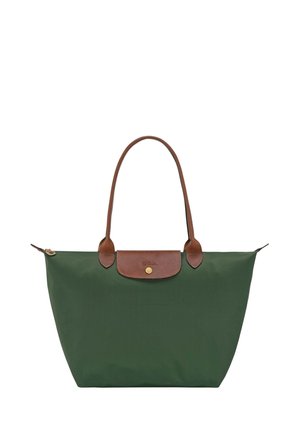 Green nylon tote bag with a brown leather top flap and handles. Features a gold button closure and a pocket on the front. Lightweight design.