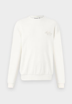 Sweatshirt branco canelado feito de tecido suave, com gola redonda, mangas longas e logótipo bordado no peito.