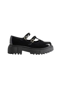 Chaussures Mary Jane en cuir verni noir avec deux sangles à boucle, semelle en caoutchouc noir épaisse et un design à bout rond avec des accents texturés.