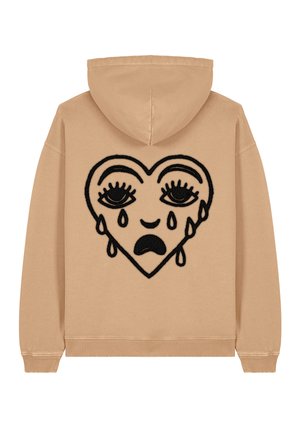 Beige hoodie featuring a large black embroidered heart design with eyes and tear details, made from soft fabric with ribbed cuffs and hem.