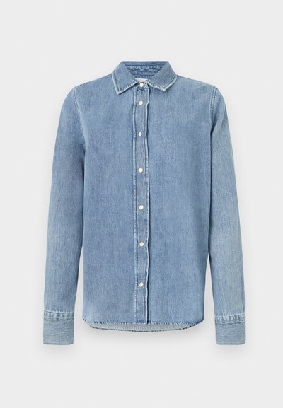 Light blue denim shirt with a collar, front button closure, long sleeves, and stitched detailing on cuffs and hem. Textured fabric.