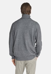 Maglione grigio in lana con colletto e orlo a coste; vestibilità ampia; texture media. Sottile motivo mélange in tutto il capo.