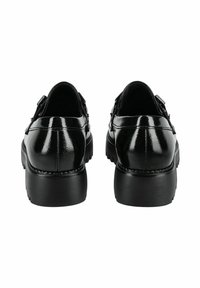 Schwarze Lacklederschuhe mit runder Zehenpartie, erhöhtem Absatz und dicker Gummisohle. Mit einem Schnallenakzent an den Seiten.