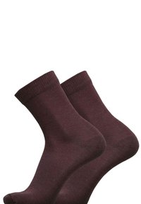Burgunderfarbene Knöchelsocken aus einem weichen, dehnbaren Material, mit einem gerippten Bund und glatter Textur sowie einem nahtlosen Design.