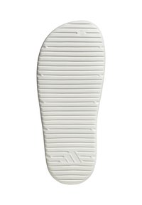 Suela de zapato de goma blanca con surcos horizontales, texturizada para agarre, que presenta un logo de tres rayas diagonales cerca del talón. Forma de puntera redondeada.