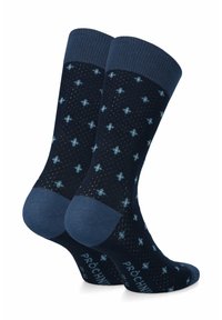 Granatowe skarpetki w jasnoniebieski wzór w kropki z żeberkowym ciemnoniebieskim mankietem, z wzmocnionymi palcami i piętą dla zwiększonej trwałości.