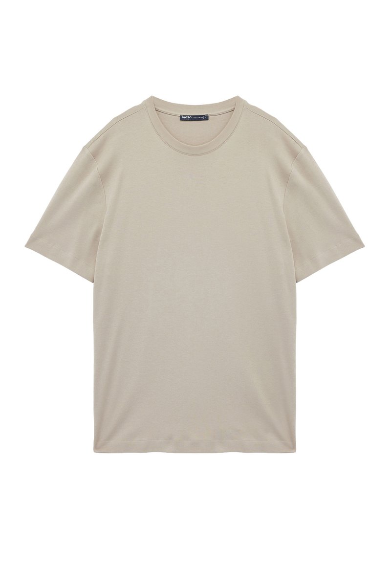 Camisa de manga corta beige hecha de suave algodón, con un escote redondo y un diseño simple, sin adornos, de corte regular.