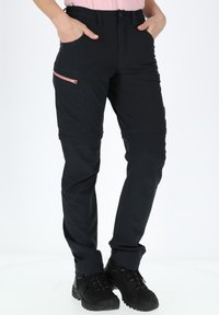 Black technical pants with a fitted design, featuring a zippered pocket in a contrasting pink color, and elastic waist. Textured fabric.