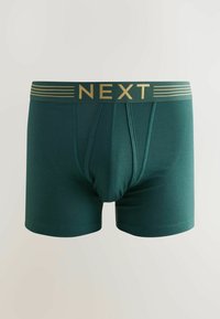 Zöld pamut boxeralsó, testes kialakítással. Arany 'NEXT' logóval ellátott derékpántja és sima felülete van.