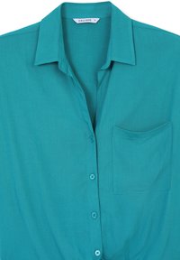 Camicia button-up verde acqua con colletto e taschino sul petto, realizzata in tessuto testurizzato, taglia s, etichetta del marchio "CALLIOPE" visibile all'interno del colletto.