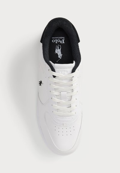 White sneaker with a smooth leather upper, black collar, and lacing. Features perforations on the toe and a logo on the side.